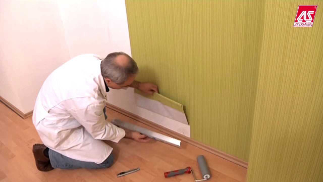 Man kneeling tools wallpapered wall free wallpaper - medium preview image