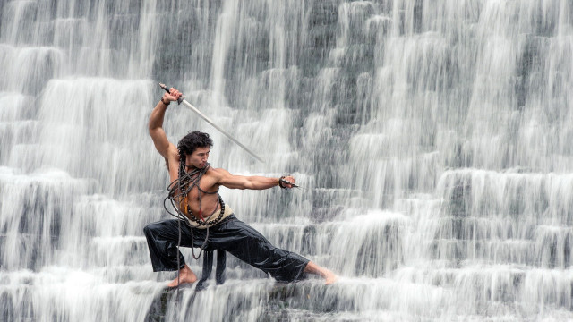 Man costume waterfall sword standing free wallpaper - medium preview image