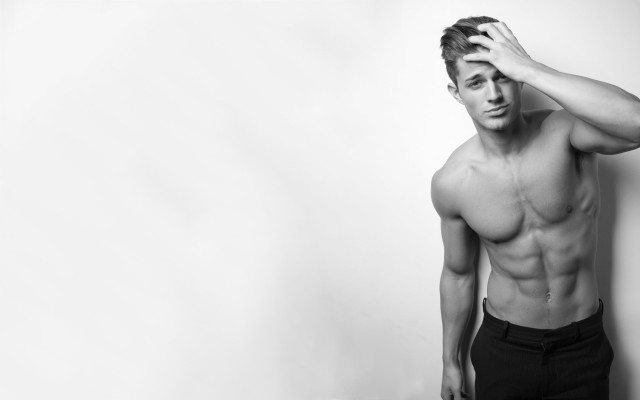 Muscular topless man holding head #2 free wallpaper - medium preview image