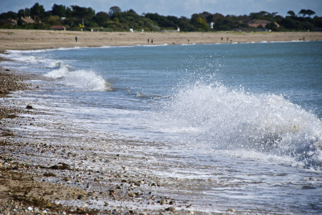 Person riding surfboard wave ocean free wallpaper - medium preview image