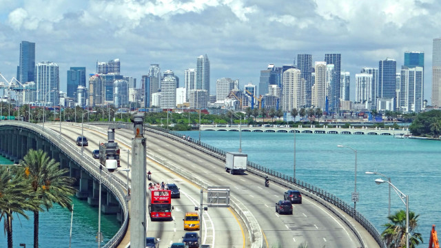 Highway traffic city tall buildings free wallpaper - medium preview image