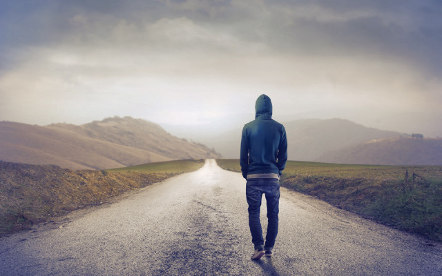 Man walking road mountain range free wallpaper - medium preview image
