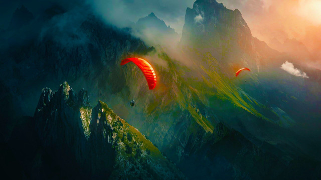 Man paragliding mountain sky parachute free wallpaper - medium preview image