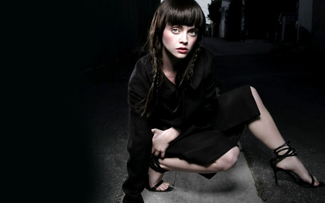 Woman black dress kneeling crossed free wallpaper - medium preview image