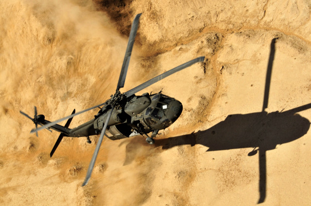 Helicopter dirt hill desert shadow free wallpaper - medium preview image