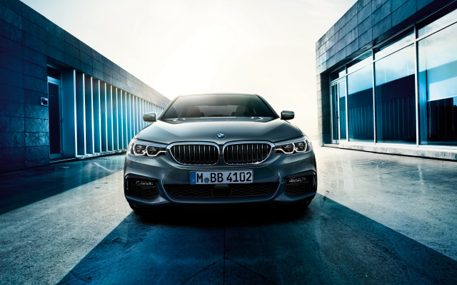 Silver car parked building sky free wallpaper - medium preview image