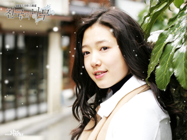 Woman tree snow falling building free wallpaper - medium preview image