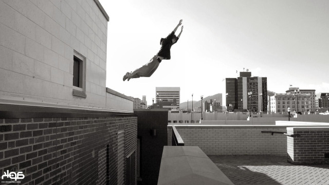 Person jumping skateboard city tall free wallpaper - medium preview image