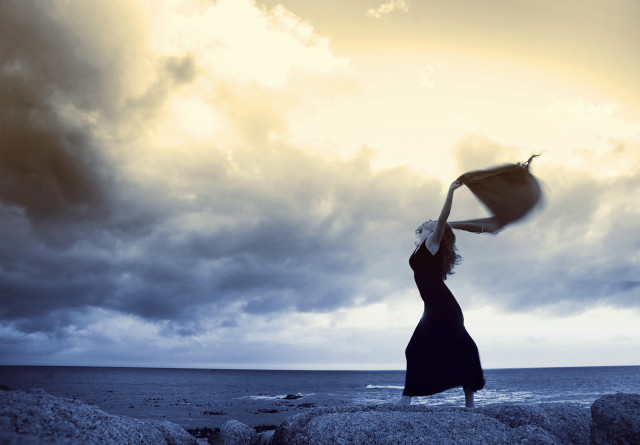 Woman rock umbrella cloudy sky free wallpaper - medium preview image
