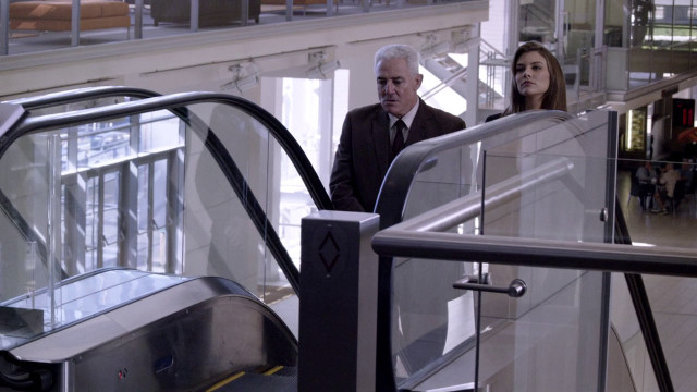 Man woman walking escalator building free wallpaper - medium preview image