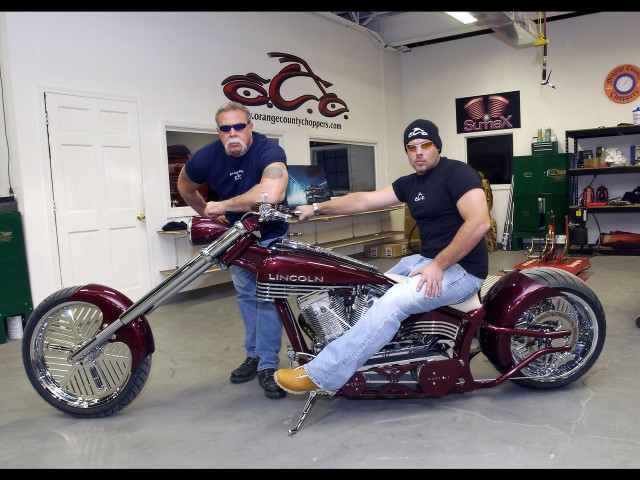 Two men motorcycle garage standing free wallpaper - medium preview image