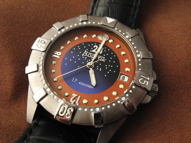 Watch red blue dial brown free wallpaper - medium preview image
