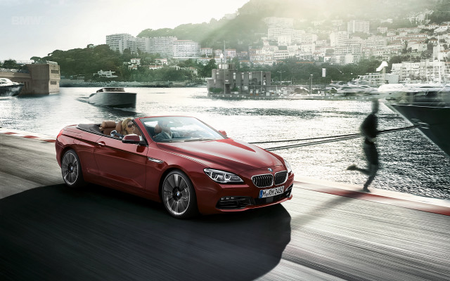 Red convertible car driving road free wallpaper - medium preview image