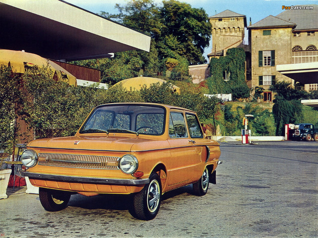 Orange car parked road building free wallpaper - medium preview image