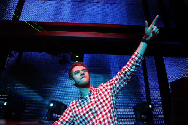 Man checkered shirt hand up free wallpaper - medium preview image