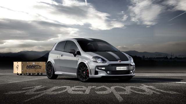 Small white car parking lot free wallpaper - medium preview image