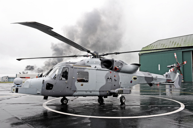 Helicopter parked wet runway smoke free wallpaper - medium preview image