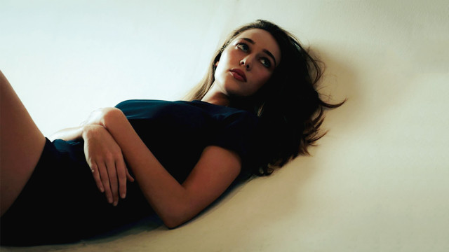 Woman laying bed crossed legs #2 free wallpaper - medium preview image
