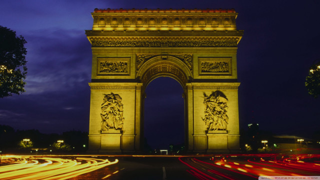 Tall tower clock nighttime street free wallpaper - medium preview image