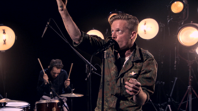 Military man singing microphone drums free wallpaper - medium preview image
