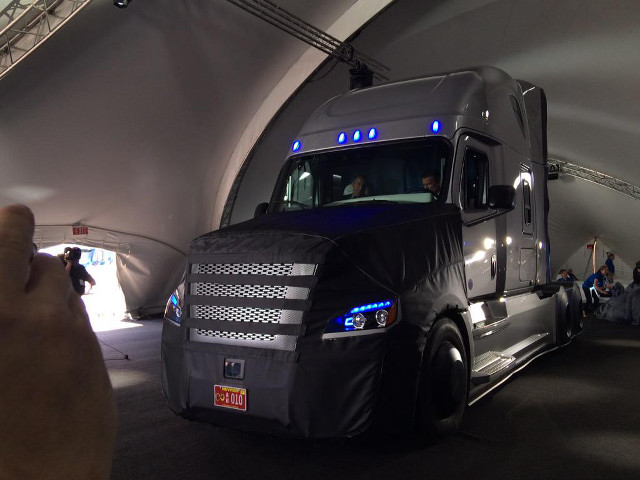 Large truck tunnel people watching free wallpaper - medium preview image
