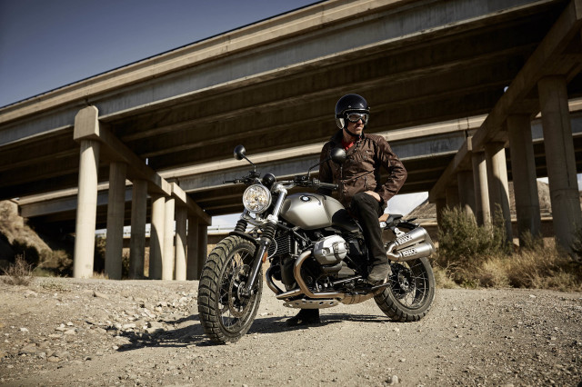 Man motorcycle dirt bridge building free wallpaper - medium preview image