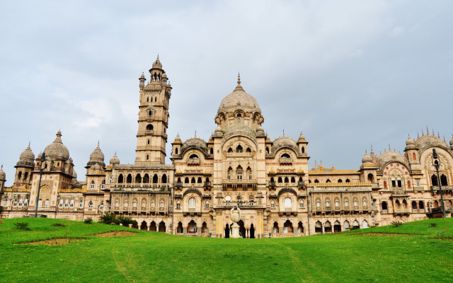 Large building clock tower grassy free wallpaper - medium preview image
