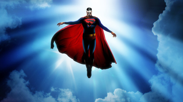 Superman flying heroic pose cape free wallpaper - medium preview image