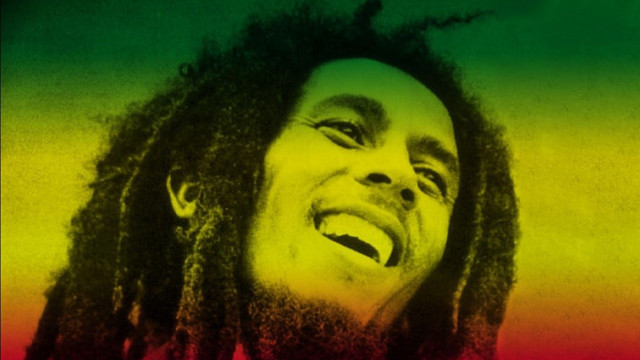 Man laughing dreadlocks red shirt free wallpaper - medium preview image