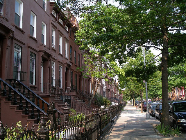 Brown houses city street cars free wallpaper - medium preview image