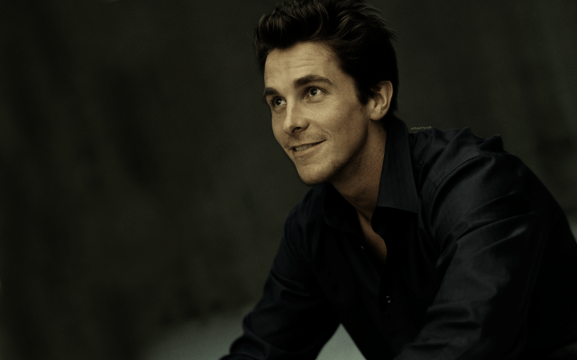 Man black shirt smiling table free wallpaper - medium preview image