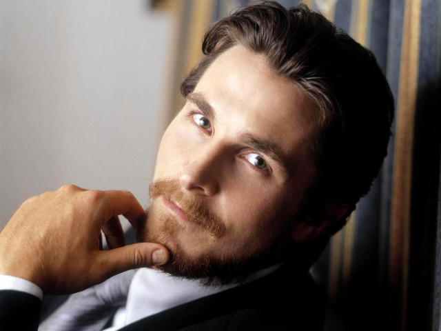 Man beard suit leaning wall free wallpaper - medium preview image