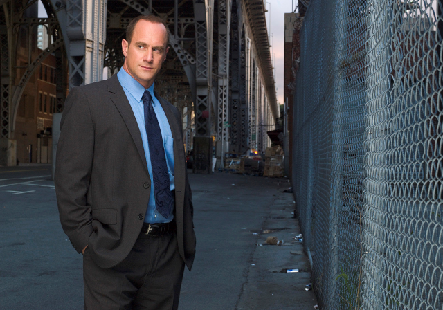 Man suit standing fence building free wallpaper - medium preview image