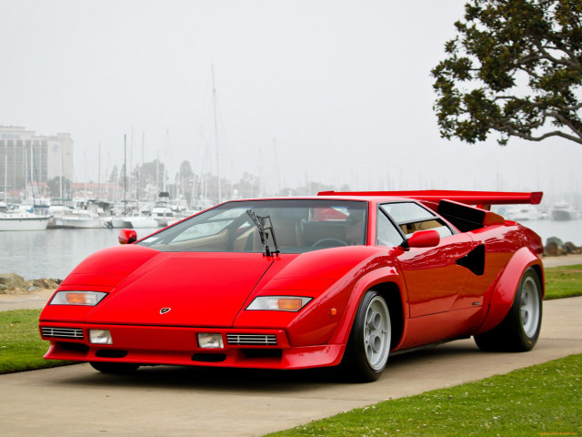 Red sports car sidewalk water free wallpaper - medium preview image