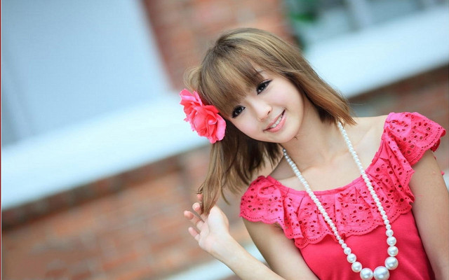 Woman red top flower hair free wallpaper - medium preview image