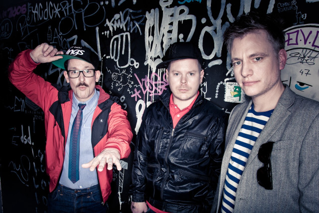 Three men graffiti wall standing free wallpaper - medium preview image