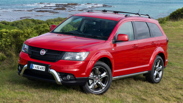 Red suv grassy hill ocean free wallpaper for desktop - medium preview image