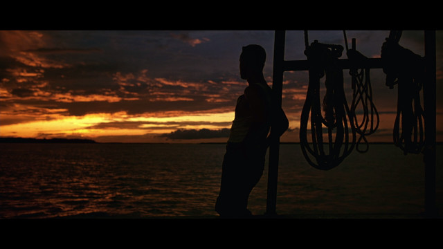 Man boat sunset bike hanging free wallpaper - medium preview image