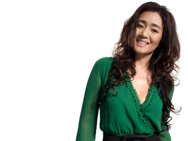 Woman green top smiling portrait free wallpaper - medium preview image