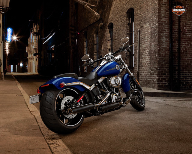 Blue motorcycle parked road building free wallpaper - medium preview image