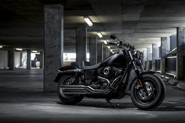 Motorcycle parking garage light person #2 free wallpaper - medium preview image