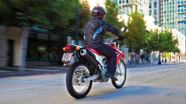 Man motorcycle street tall buildings #2 free wallpaper - medium preview image