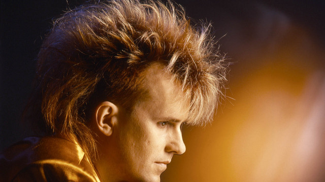 Mohawk man jacket distant gaze free wallpaper - medium preview image