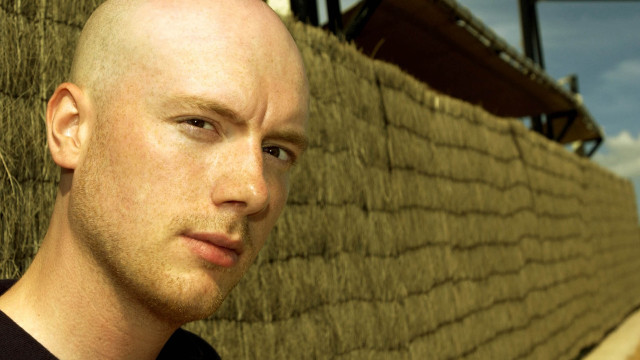 Bald man straw roof sky free wallpaper - medium preview image