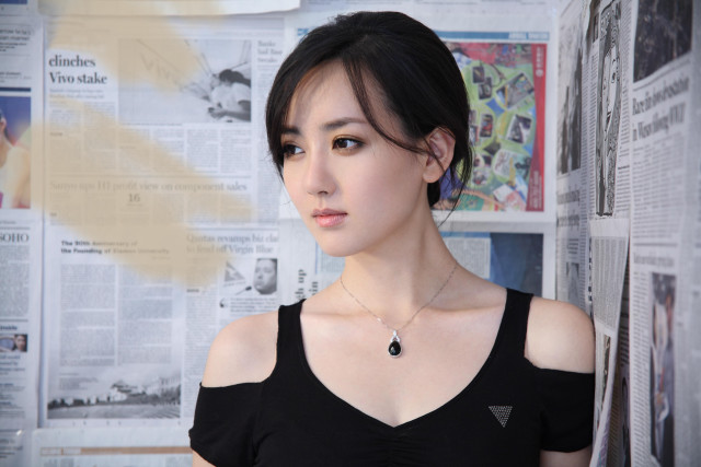 Woman black top wall newspapers free wallpaper - medium preview image