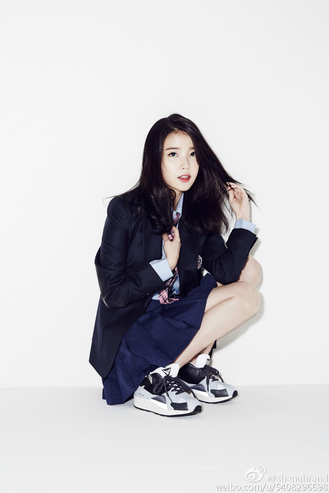 Woman suit crossed legs blue free wallpaper - medium preview image