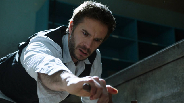 Man vest pointing railing bottle free wallpaper - medium preview image