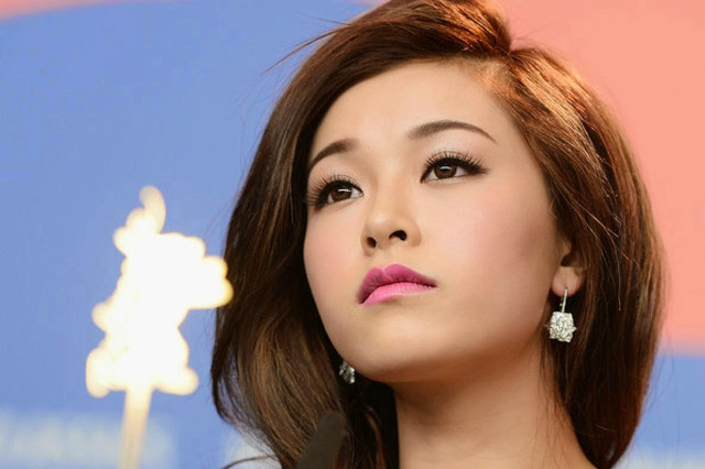 Woman pink lipstick earrings looking free wallpaper - medium preview image