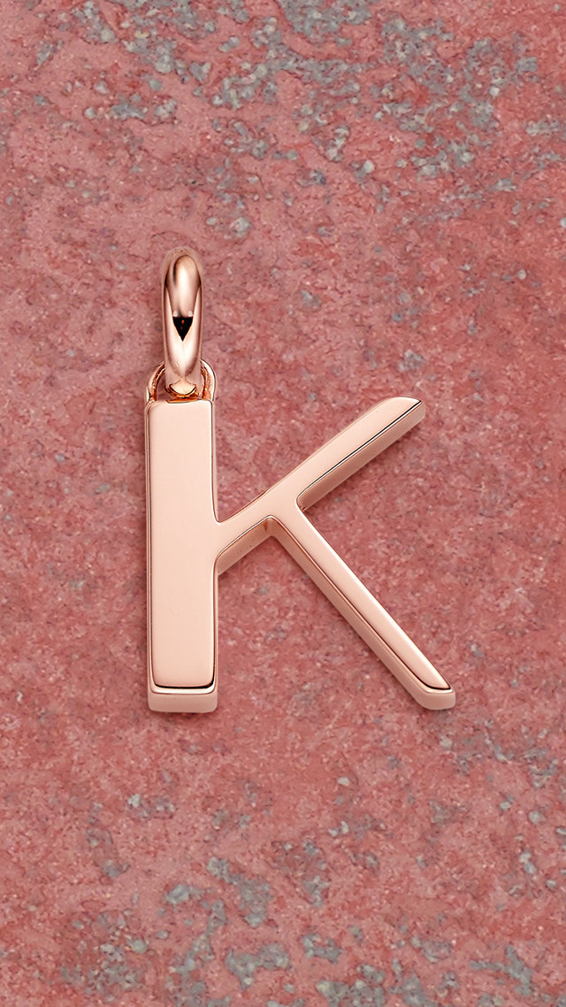Gold letter k pink surface free wallpaper - medium preview image