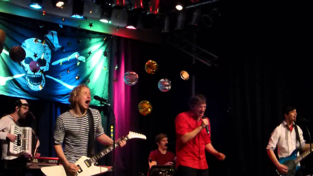 Stage guitarists performance microphone banner free wallpaper - medium preview image